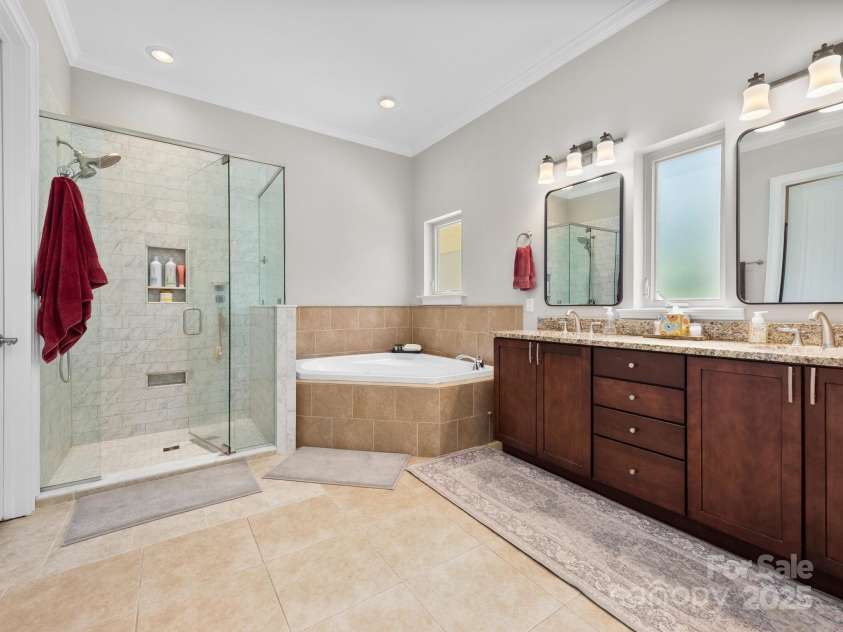 102 Gap Creek Road, Fletcher, NC 28732.  MLS# CAR4275624, YatesRealty ID 23580. New Oversized Glass Shower w/ All New Tile and Custom Shower Built-ins