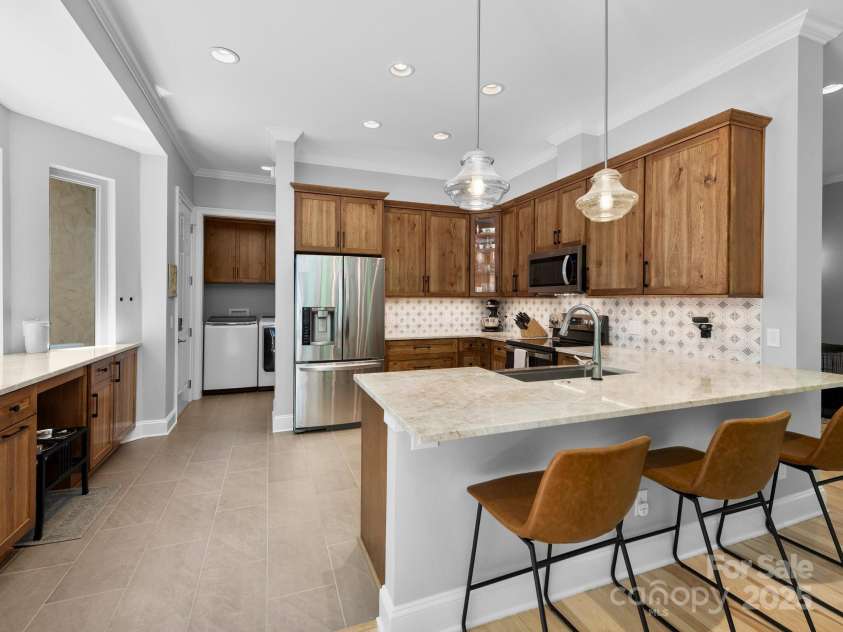 102 Gap Creek Road, Fletcher, NC 28732.  MLS# CAR4275624, YatesRealty ID 23580. New Remodeled Kitchen Featuring Laundry Room w Cabinets. Along with a Full Pantry(Not Shown)