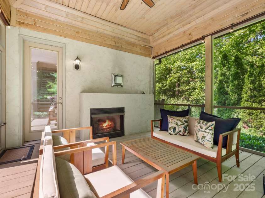 102 Gap Creek Road, Fletcher, NC 28732.  MLS# CAR4275624, YatesRealty ID 23580. Outdoor Gas Fireplace on Rear Screened Porch. Perfect for all 3 Seasons