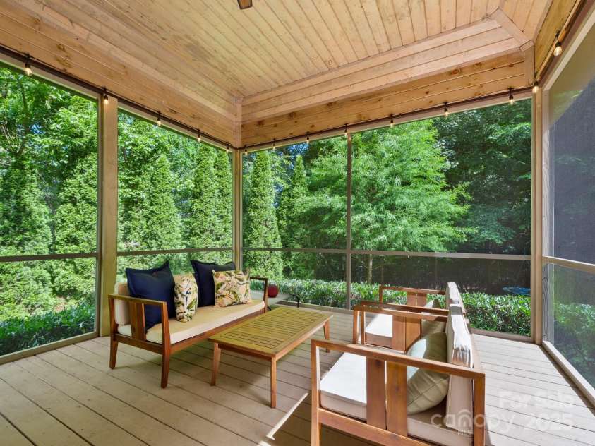 102 Gap Creek Road, Fletcher, NC 28732.  MLS# CAR4275624, YatesRealty ID 23580. Rear Screened Porch w/ Ceiling Fan. Ready for Many Lazy Afternoons or Outdoor Work From Home
