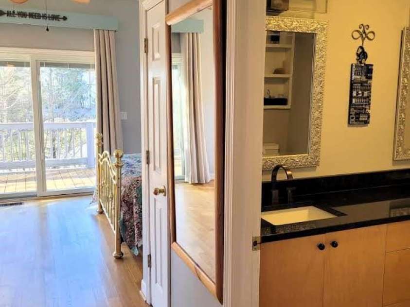 105 Elm Drive, Asheville, NC 28805.  MLS# CAR4217648, YatesRealty ID 23586. Guest or primary bedroom with en suite