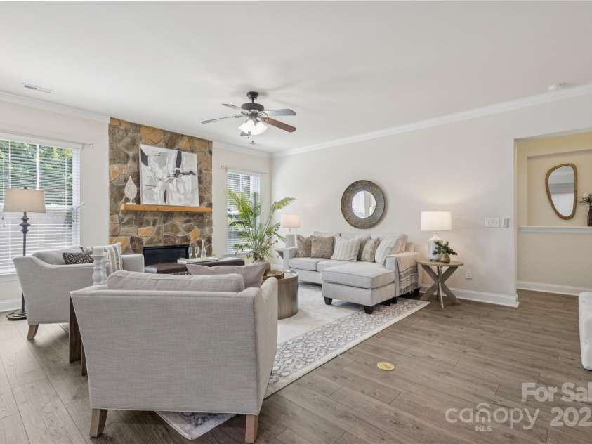 196 Hawks Creek Parkway, Fort Mill, SC 29708.  MLS# CAR4271545, YatesRealty ID 23591. Great room featuring a cozy gas log fireplace