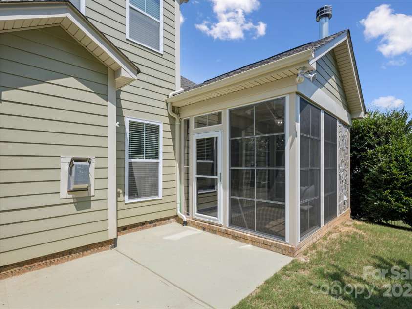 196 Hawks Creek Parkway, Fort Mill, SC 29708.  MLS# CAR4271545, YatesRealty ID 23591. Sunroom opening to back patio