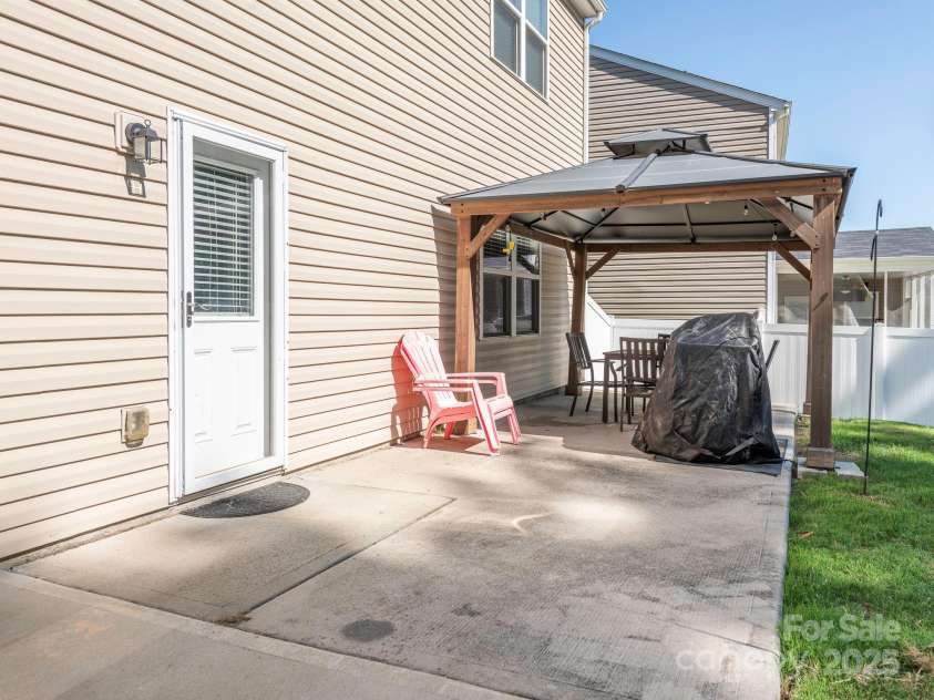 9123 Magnolia Lily Avenue, Charlotte, NC 28227.  MLS# CAR4272877, YatesRealty ID 23592. Backyard Patio & Pergola