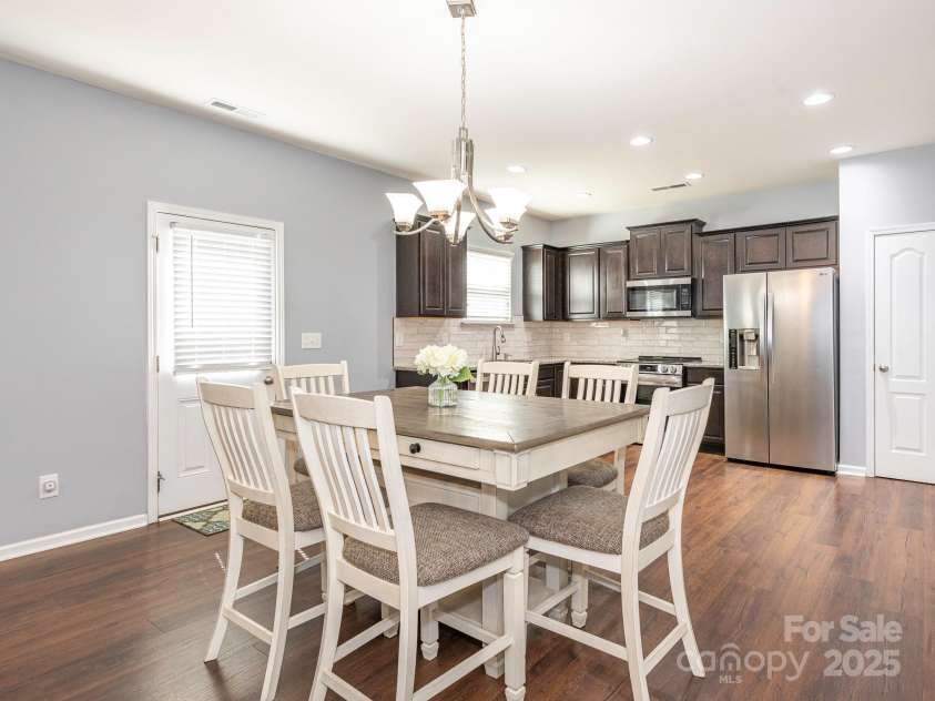 9123 Magnolia Lily Avenue, Charlotte, NC 28227.  MLS# CAR4272877, YatesRealty ID 23592. Dining area into Kitchen