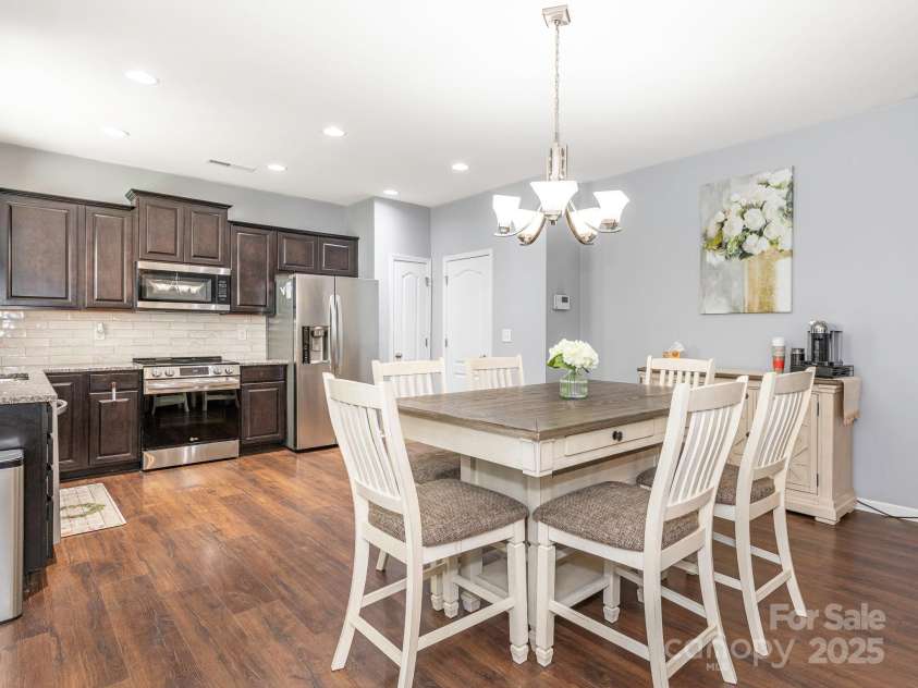 9123 Magnolia Lily Avenue, Charlotte, NC 28227.  MLS# CAR4272877, YatesRealty ID 23592. Dining area & Kitchen