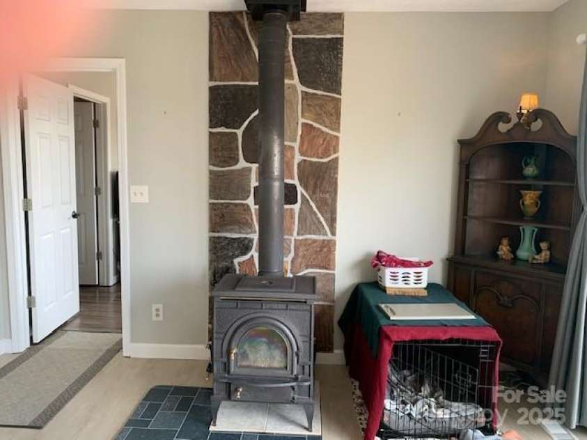1474 HOLIDAY Drive, Hendersonville, NC 28739.  MLS# CAR4242849, YatesRealty ID 236. WHATEVER YOUR TYPE ... THIS IS WOODBURNING IN THE LIVINGROOM AND PROPANE (SIMILAR LOOK) IN THE LOWER GREAT ROOM ... OR NO MUS OR FUS- USE THE HEATPUMP ... OR ELECTRIC