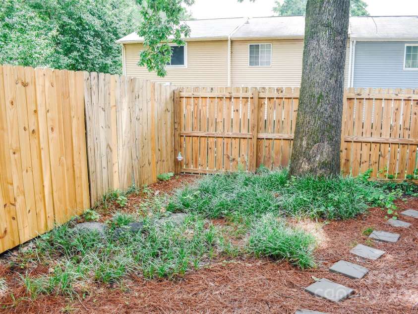7526 Holly Grove Court, Charlotte, NC 28227.  MLS# CAR4269368, YatesRealty ID 23603. Backyard is fully fenced