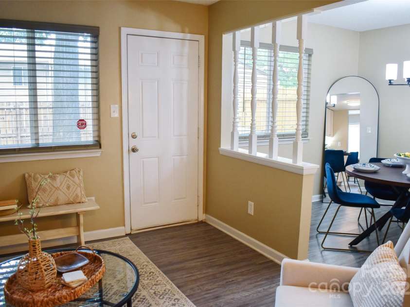 7526 Holly Grove Court, Charlotte, NC 28227.  MLS# CAR4269368, YatesRealty ID 23603. Opening from the den into the dining room. Rooms overlook the backyard.