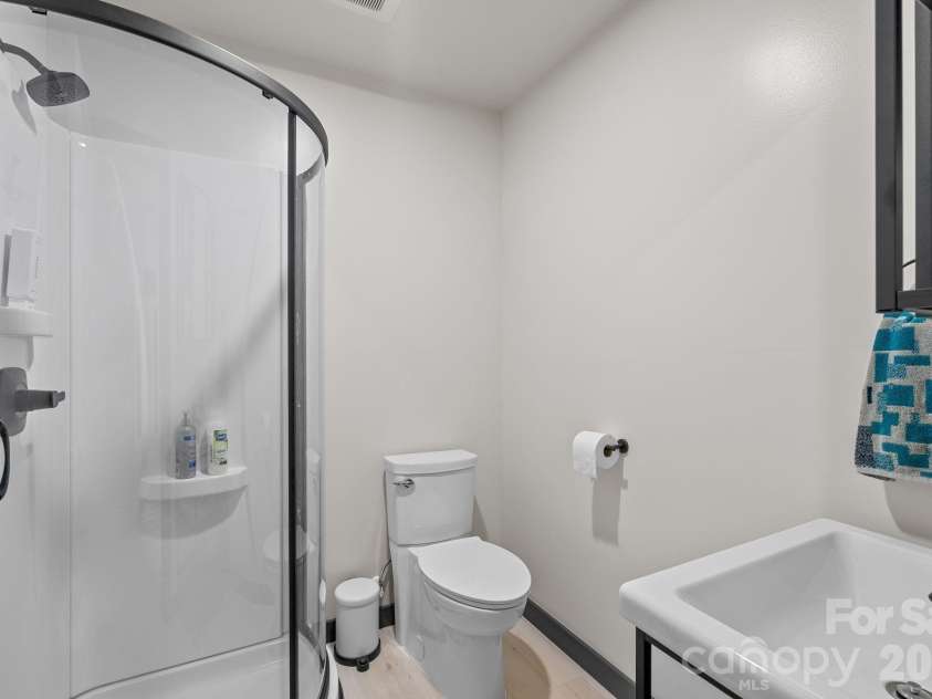 186 Sea Wish Way, Lake Lure, NC 28746.  MLS# CAR4364300, YatesRealty ID 23604. Lower level bathroom includes a step in shower .