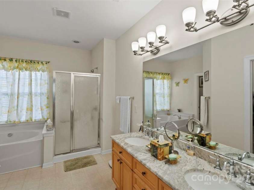 4966 Riverview Drive, Harrisburg, NC 28075.  MLS# CAR4271852, YatesRealty ID 23607. Owner's Bath