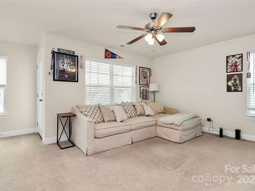 139 Suggs Mill Drive, Mooresville, NC 28115.  MLS# CAR4272116, YatesRealty ID 23610. Enjoy a second view of the bright and open loft space, featuring direct access to the second-story balcony—perfect for fresh air, relaxing, and taking in the views right from your entertainment area.