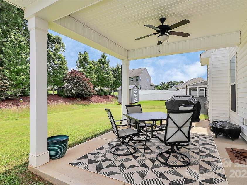 139 Suggs Mill Drive, Mooresville, NC 28115.  MLS# CAR4272116, YatesRealty ID 23610. Enjoy outdoor living year-round on the covered patio, complete with a ceiling fan to keep you cool and comfortable while relaxing or entertaining.