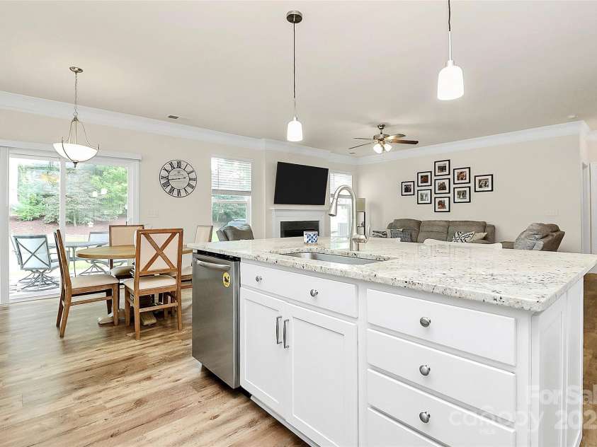 139 Suggs Mill Drive, Mooresville, NC 28115.  MLS# CAR4272116, YatesRealty ID 23610. Enjoy seamless living with a kitchen that opens to the breakfast area, outdoor patio, and family room—creating the perfect flow for everyday life and entertaining. Whether you're cooking, dining, or relaxing, you’ll