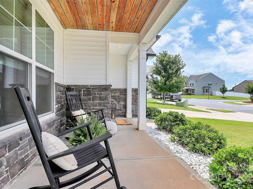 139 Suggs Mill Drive, Mooresville, NC 28115.  MLS# CAR4272116, YatesRealty ID 23610. Step onto the classic rocking chair front porch and feel instantly at home.
