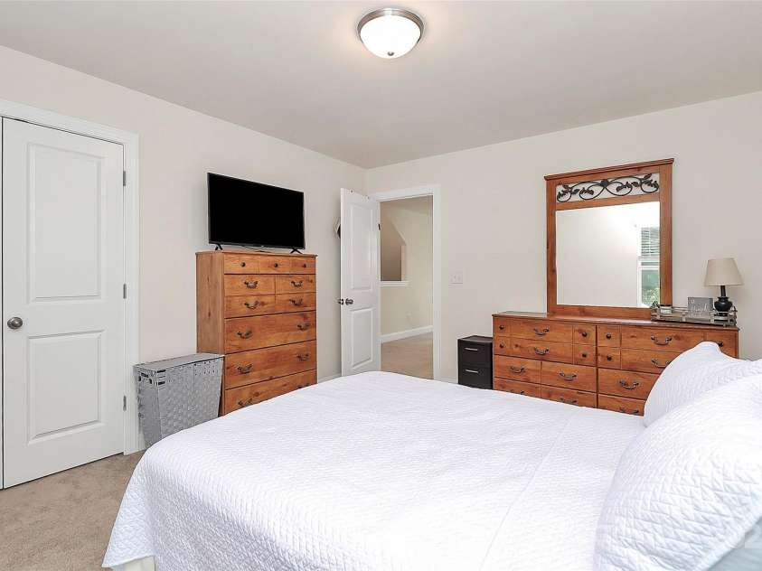 139 Suggs Mill Drive, Mooresville, NC 28115.  MLS# CAR4272116, YatesRealty ID 23610. The third bedroom on the second floor boasts a large closet, providing generous storage and a comfortable space that’s perfect for guests, or a home office