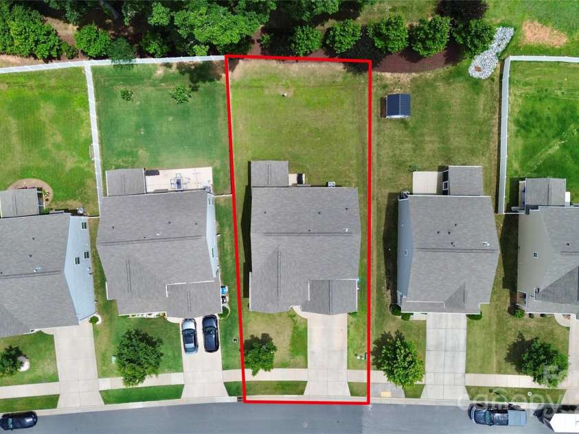 139 Suggs Mill Drive, Mooresville, NC 28115.  MLS# CAR4272116, YatesRealty ID 23610. This aerial view highlights the property’s spacious yard, outlined in red to show the approximate boundaries—offering a clear perspective of the generous outdoor space available for your enjoyment and activities.
