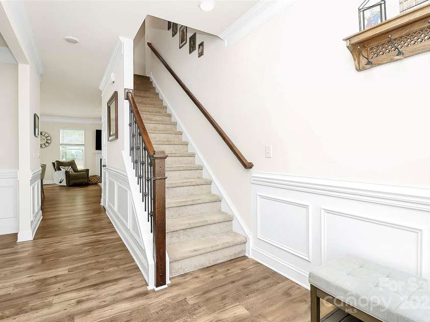 139 Suggs Mill Drive, Mooresville, NC 28115.  MLS# CAR4272116, YatesRealty ID 23610. Welcome guests in style with a beautifully appointed foyer featuring elegant wainscoting and durable luxury vinyl plank (LVP) flooring.