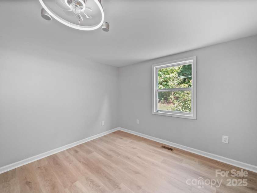 285 Baney Drive, Lexington, NC 27292.  MLS# CAR4275526, YatesRealty ID 23617. Back secondary bedroom