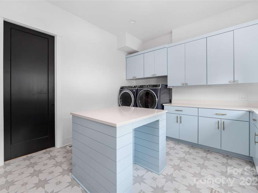 10119 Laurier Lane, Huntersville, NC 28078.  MLS# CAR4273565, YatesRealty ID 23623. Downstairs Laundry Room