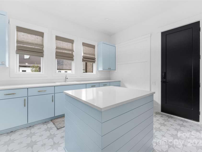 10119 Laurier Lane, Huntersville, NC 28078.  MLS# CAR4273565, YatesRealty ID 23623. Downstairs Laundry Room