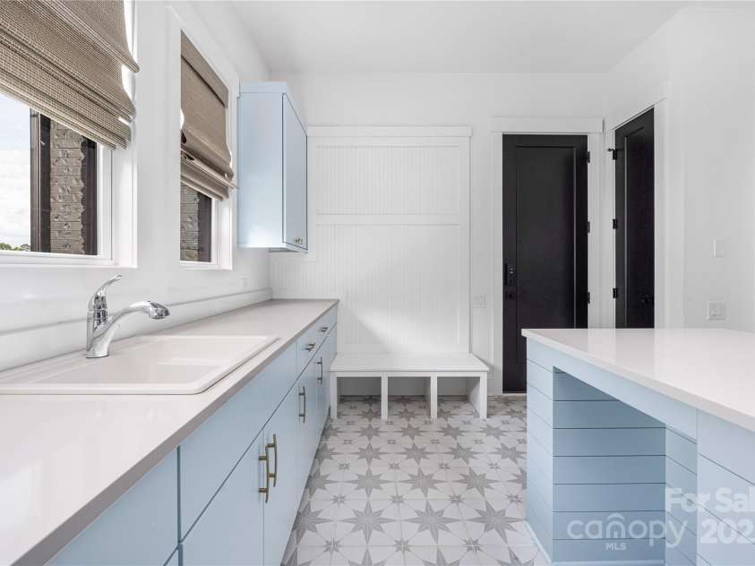 10119 Laurier Lane, Huntersville, NC 28078.  MLS# CAR4273565, YatesRealty ID 23623. Downstairs Laundry Room
