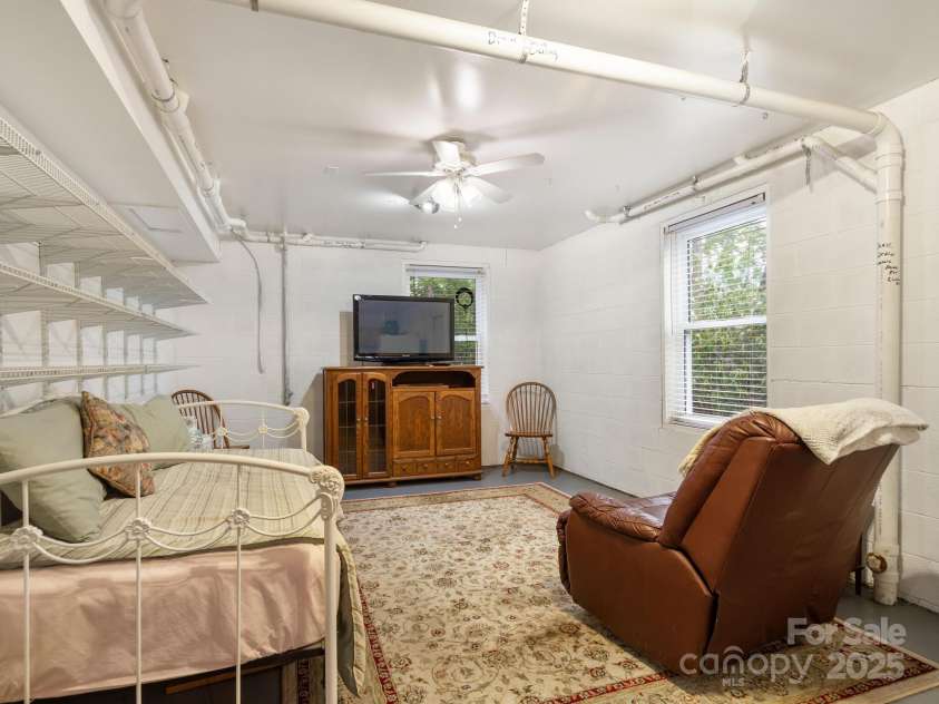 66 Condor Court, Hendersonville, NC 28792.  MLS# CAR4274638, YatesRealty ID 23627. Basement Living Room