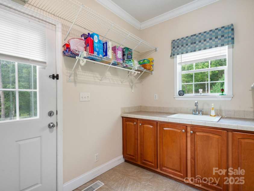 66 Condor Court, Hendersonville, NC 28792.  MLS# CAR4274638, YatesRealty ID 23627. Laundry Room- Main Level