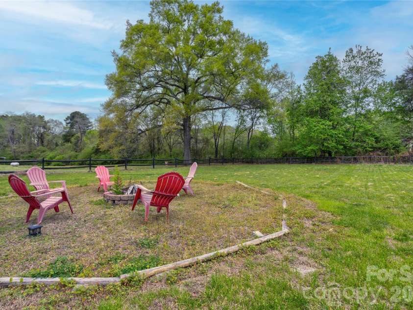 2705 Plantation Way, Albemarle, NC 28001.  MLS# CAR4365958, YatesRealty ID 23630. Backyard fire pit/fenced in 