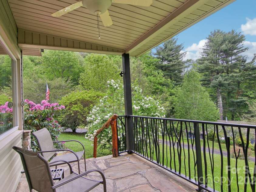 51 Atari Road, Waynesville, NC 28786.  MLS# CAR4256064, YatesRealty ID 23630. Coffee and reading..ahhh enjoy the custom made cast iron railings