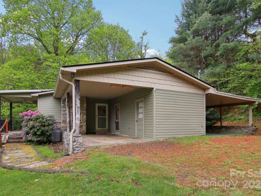 51 Atari Road, Waynesville, NC 28786.  MLS# CAR4256064, YatesRealty ID 23630. Two carports and plenty of parking for about 6 cars