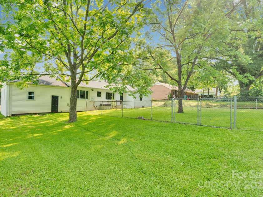 506 Maine Avenue, Bessemer City, NC 28016.  MLS# CAR4077822, YatesRealty ID 23636. Enjoy peaceful mornings and breezy evenings in your large, level backyard—ideal for gardening, playtime, or future outdoor upgrades.