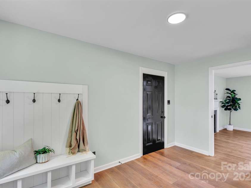 506 Maine Avenue, Bessemer City, NC 28016.  MLS# CAR4077822, YatesRealty ID 23636. This isn’t just a laundry room—it’s your command center for daily life. With built-in cabinets for extra storage, butcher block counter for folding clothes and a practical drop zone, this mudroom handles muddy shoes, 