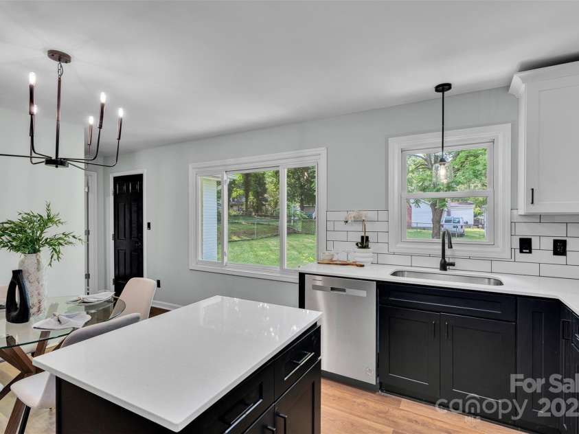 506 Maine Avenue, Bessemer City, NC 28016.  MLS# CAR4077822, YatesRealty ID 23636. Whip up meals in a kitchen that shines with black and white shaker cabinets, stainless steel appliances, and sleek quartz countertops.