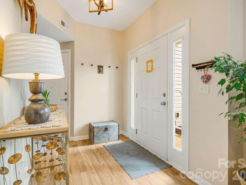 20 Stone River Drive, Asheville, NC 28804.  MLS# CAR4380829, YatesRealty ID 23637. Front entry area from dining room