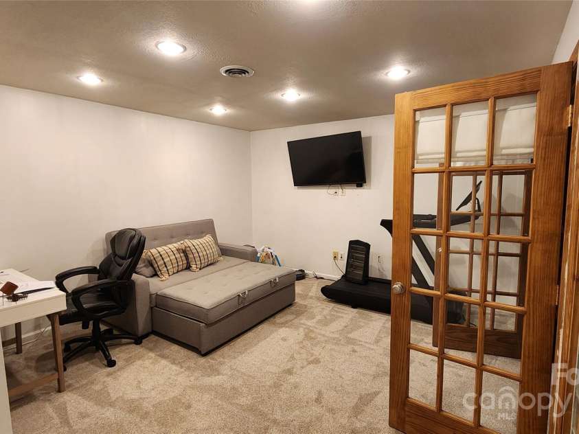 306 Henry Dingus Way, Maggie Valley, NC 28751.  MLS# CAR4183056, YatesRealty ID 23643. Finished basement area