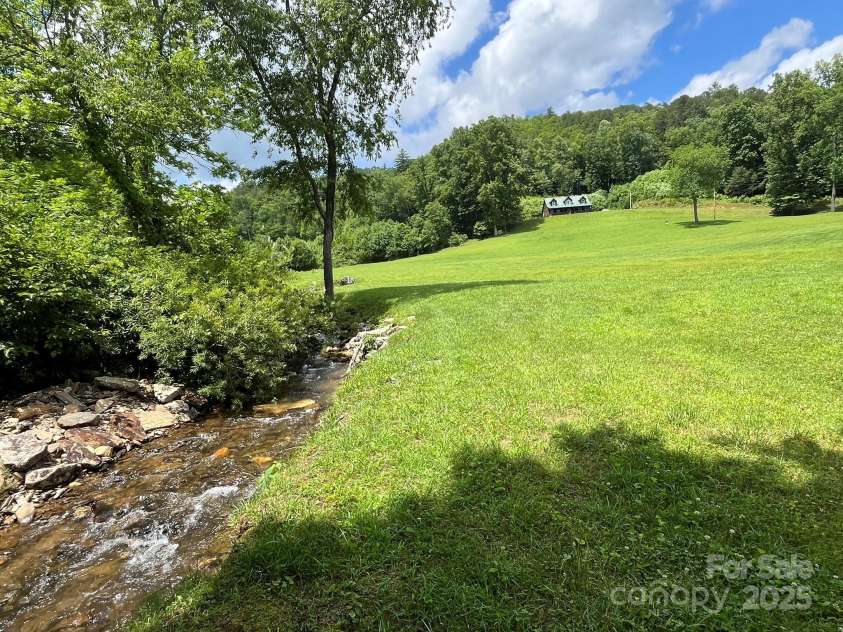 621 Cherryfield Creek, Brevard, NC 28712.  MLS# CAR4269516, YatesRealty ID 23646. Bold Rushing Creek Borders Property