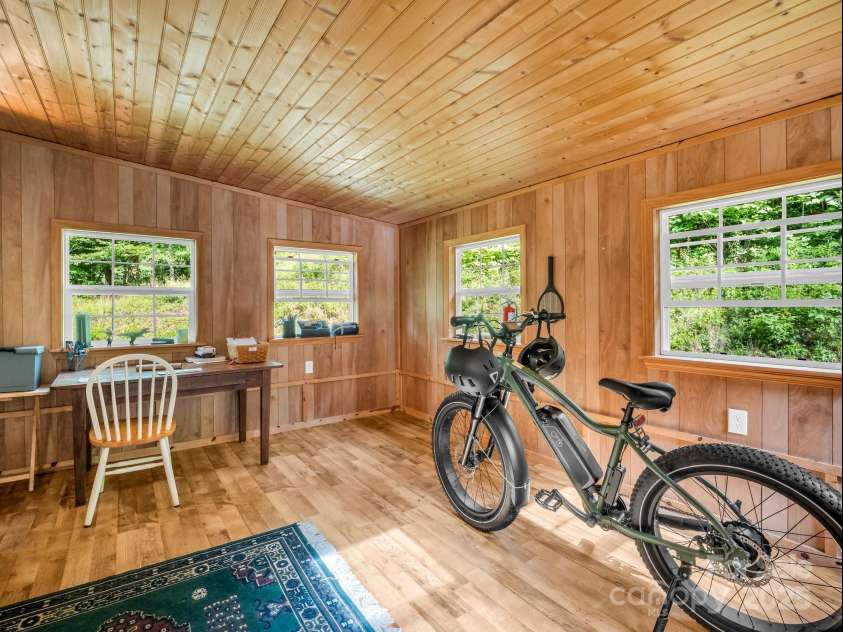 621 Cherryfield Creek, Brevard, NC 28712.  MLS# CAR4269516, YatesRealty ID 23646. Finished Sunroom