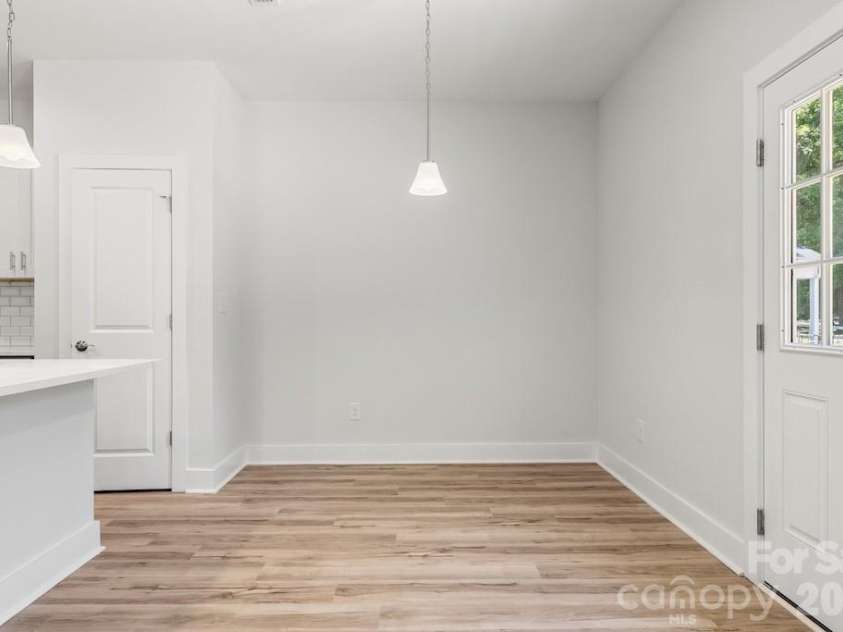 1214 Patterson Street, Shelby, NC 28152.  MLS# CAR4379896, YatesRealty ID 23649. Dining area/kitchen/back door