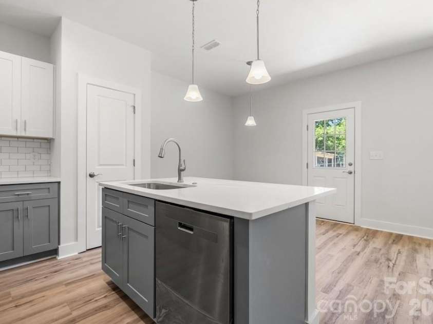 1214 Patterson Street, Shelby, NC 28152.  MLS# CAR4379896, YatesRealty ID 23649. Kitchen/dining area/back door