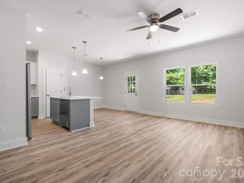 1214 Patterson Street, Shelby, NC 28152.  MLS# CAR4379896, YatesRealty ID 23649. Kitchen/dining/living area
