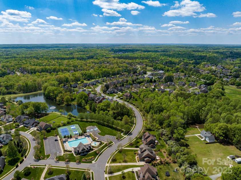 1116 Crooked River Drive, Waxhaw, NC 28173.  MLS# CAR4250432, YatesRealty ID 23650. Club House, Junior Olympic Pool, Waking Trails, Tennis, Pickle ball & Game Court. Stocked Pond & Dock