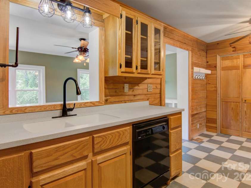 4962 Serenity Lane, Granite Falls, NC 28630.  MLS# CAR4263669, YatesRealty ID 23651. Kitchen looking in sunroom/ dining area