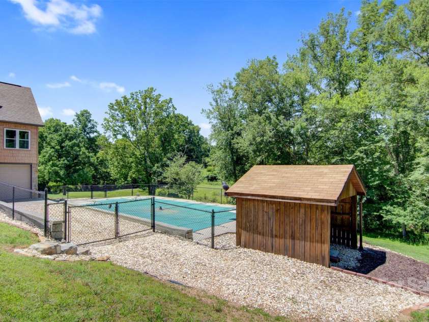 4962 Serenity Lane, Granite Falls, NC 28630.  MLS# CAR4263669, YatesRealty ID 23651. Shed built to cover pool pump