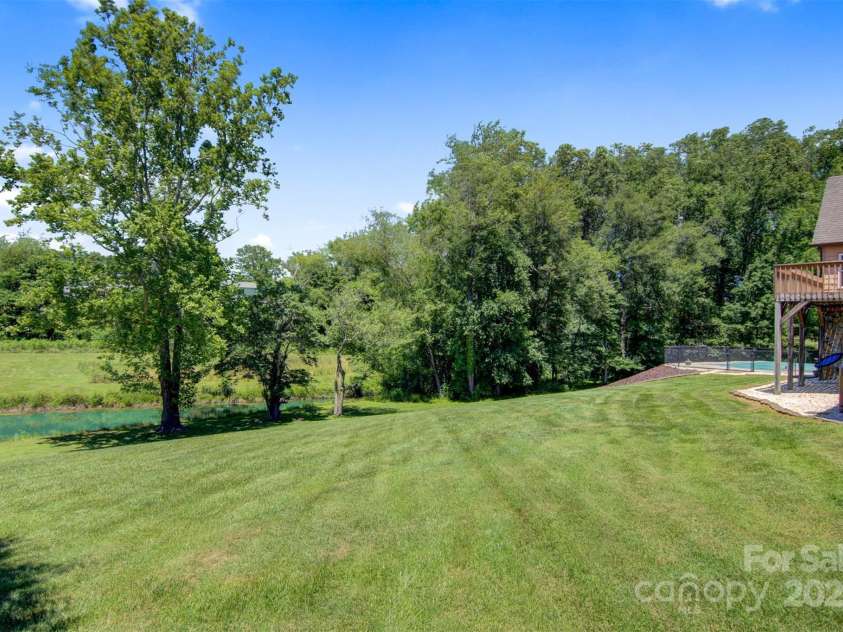 4962 Serenity Lane, Granite Falls, NC 28630.  MLS# CAR4263669, YatesRealty ID 23651. Side yard