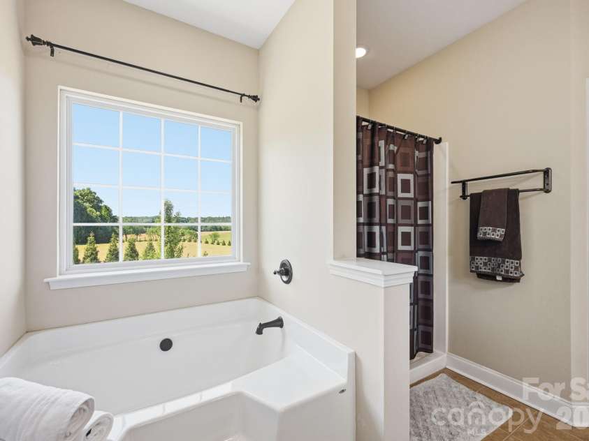 1434 Steeplechase Drive, Mount Pleasant, NC 28124.  MLS# CAR4378716, YatesRealty ID 23653. Ahhh...let go, recharge and take a mindful pause while soaking in your spacious tub (and maybe have that glass of wine too)!