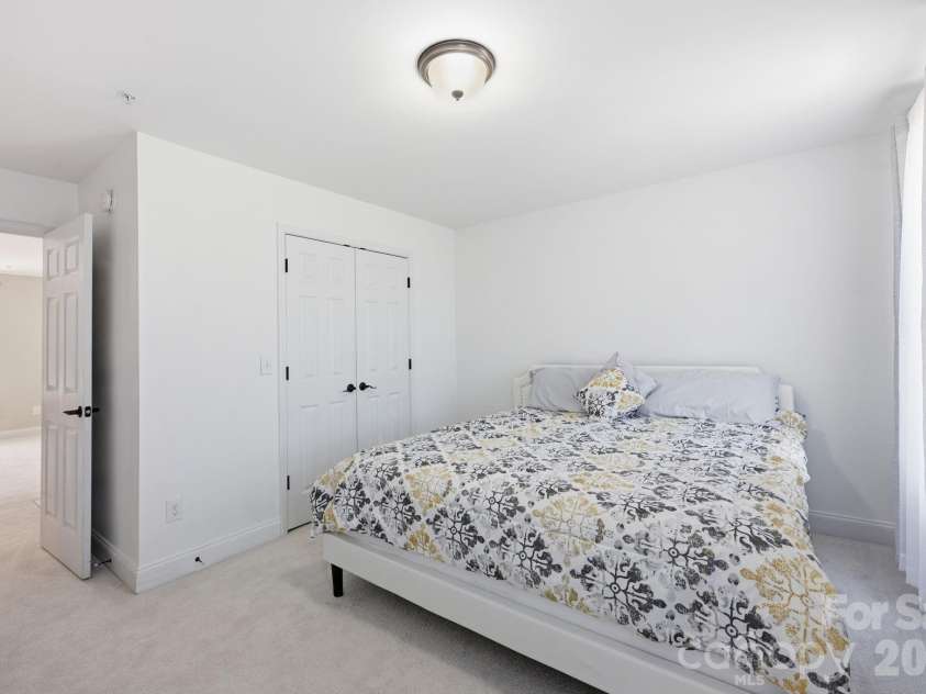 1434 Steeplechase Drive, Mount Pleasant, NC 28124.  MLS# CAR4378716, YatesRealty ID 23653. Guest Bedroom #4 has convenient access to the Loft area! Just think...maybe this would be a wonderful craft or gaming room as well!