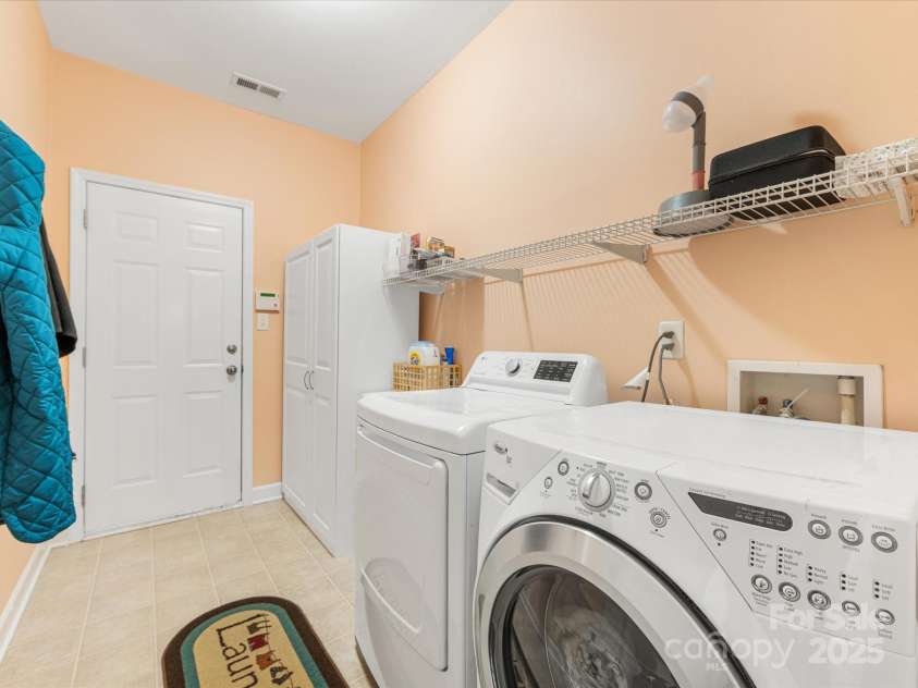 4434 Patriots Hill Road, Mint Hill, NC 28227.  MLS# CAR4240294, YatesRealty ID 23653. Spacious laundry with storage. W/D convey!