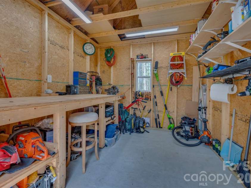 88 Pounding Mill None, Hendersonville, NC 28792.  MLS# CAR4367016, YatesRealty ID 23655. Workbench, metal pegboard and compressor does not convey.