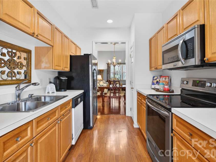 18310 Taffrail Way, Cornelius, NC 28031.  MLS# CAR4372401, YatesRealty ID 23659. Galley style kitchen with all the essential appliances